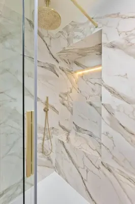 a bathroom with marble walls and a shower at The Kings Park Luxury Residence in Stirling
