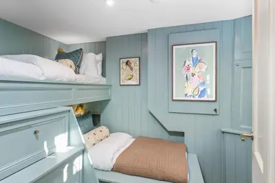 a room with two bunk beds and a stairway at The Kings Park Luxury Residence in Stirling