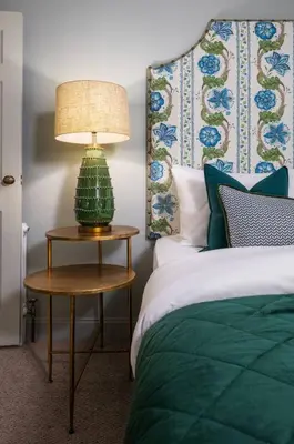 a bedroom with a bed and a lamp on a table at Ledi Lookout Callander in Stirling