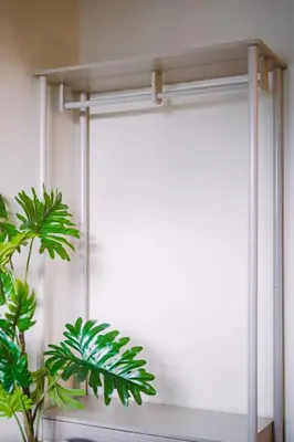 a window with a curtain and a plant in a room at JW Executive ApartHouse in Glasgow