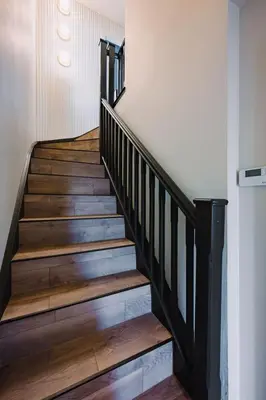 a staircase with wooden steps in a house at JW Executive ApartHouse in Glasgow
