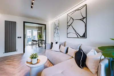 a living room with a couch and a table at JW Executive ApartHouse in Glasgow