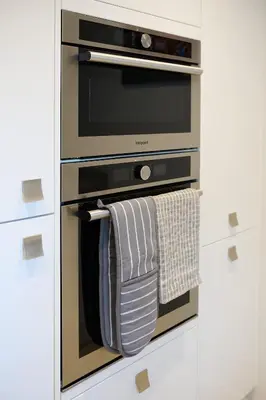 a kitchen with a oven with towels hanging from it at Charming 2BR Oban Home - Quiet area with free parking in Oban