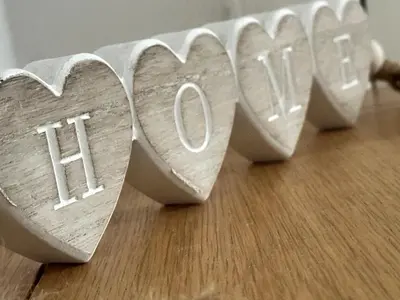 a piece of wood with the word truth written on it at Appin Apartments - Welcome to a delightful and cozy one bedroom flat in Glasgow