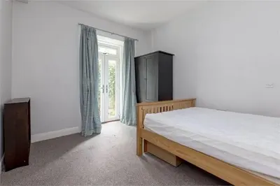 a bedroom with a bed and a window at 3 Bedrooms Flat in Central Edinburgh New Town , Lothian Road in Edinburgh