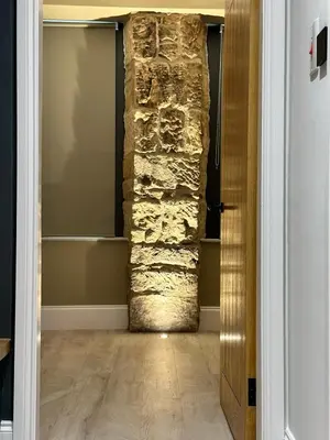 a hallway with a stone pillar in a room at Glasgow West End Tenement Apartment in Glasgow