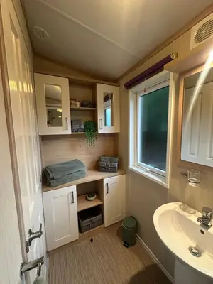 a small bathroom with a sink and a sink at Glen-coo in Auchterarder