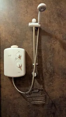 a hair dryer is attached to a wall at Bracken Lodge in Dalavich