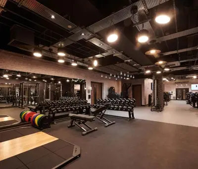 a gym with rows of benches and equipment in it at 2 Bedroom detached lodge overlooking Loch Lomond in Balloch