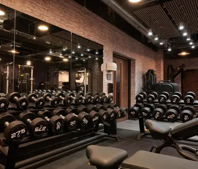 a gym with a large rack of dumbbells at 2 Bedroom detached lodge overlooking Loch Lomond in Balloch