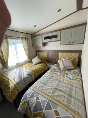 a bedroom with two beds in a room at Wemyss Bay Beaumont Elite in Skelmorlie