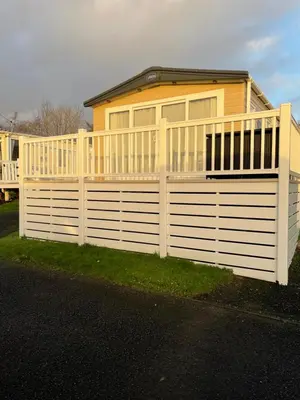 a house with a white fence in front of it at Wemyss Bay Beaumont Elite in Skelmorlie