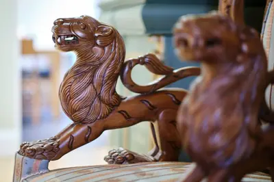 a wooden carving of a lion riding a horse at Bruce on the Row-Historic Elegance near Edinburgh by Urban Haggis Stays in Dunfermline