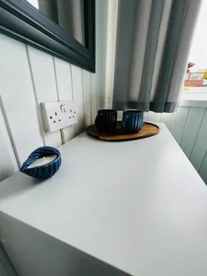 two blue vases sitting on top of a table at Tigh Na Sealladh in Dunoon
