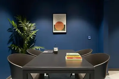 a black table with chairs and a book on it at For Students Only Westfield in Edinburgh in Edinburgh