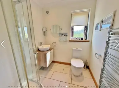 a bathroom with a toilet and a sink and a shower at Sealladh Mor-Cottage in Lamlash, Arran in Lamlash