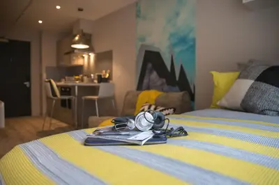 a pair of goggles on a bed in a room at For Students Only - Willowbank in Glasgow in Glasgow