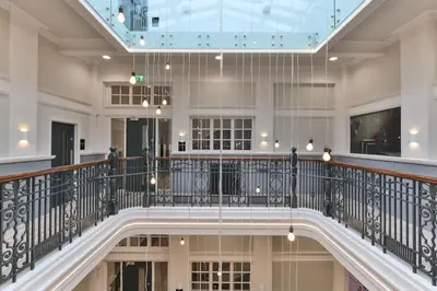 a staircase in a building with a glass ceiling at For Students Only - Willowbank in Glasgow in Glasgow