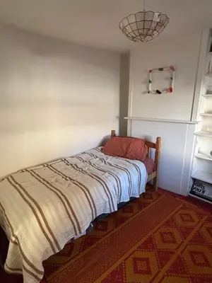 a bedroom with a bed in a room at Ivy Cottage in Causewayhead