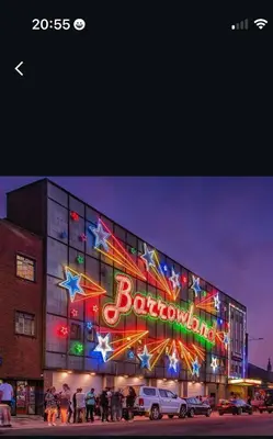 a building with a neon sign on the side of it at Cosy Glasgow Barrowlands stay-spacious & free parking in Glasgow
