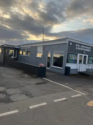 a parking lot in front of a building at Montrose No3 - Turnberry Holiday Park in Turnberry