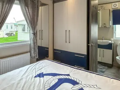 a bedroom with a bed and a sink at Ocean Bay View - Ukc7143 in Ayr