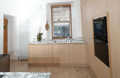 a kitchen with a sink and a window at Carmona Bank in Dunoon