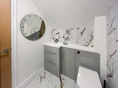 a bathroom with a sink and a mirror at Eriska View in Port Appin