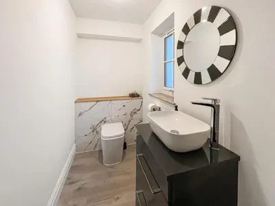 a bathroom with a sink and a mirror at Eriska View in Port Appin