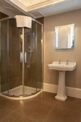 a bathroom with a shower and a sink at Inglewood House and Spa in Alloa