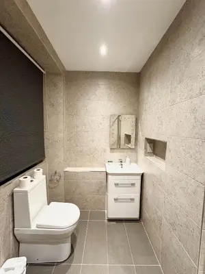 a bathroom with a white toilet and a sink at West Coates Mansion in Edinburgh
