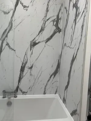 a bathroom with a black and white marble wall at Craigievar Cottage Skelmorlie in Skelmorlie
