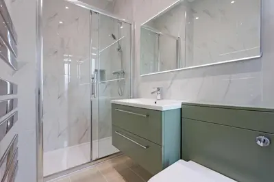 a bathroom with a shower and a sink and a toilet at Savoy 5 in Ayr