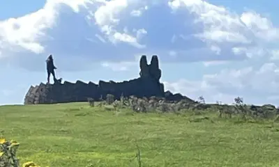 a man standing on top of a hill with a rabbit at Room with a view in Irvine
