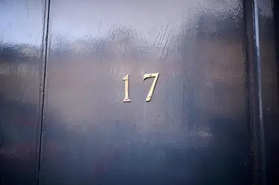 a metal door with the number on it at The Oban Apartment in Oban