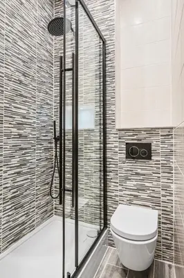 a bathroom with a toilet and a shower at The Oban Apartment in Oban
