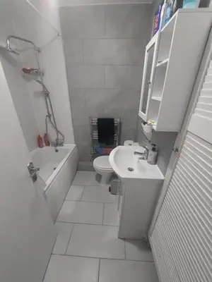 a white bathroom with a sink and a toilet at London Cozy Single Room in Moffat