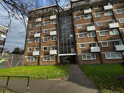 a large brick building with windows on the side of it at Entire 4 bedrooms Apartment Sleep 8 Central London ZONE1 in Moffat