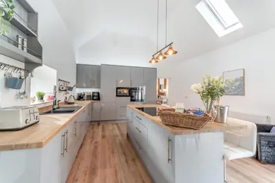 a kitchen with white cabinets and a counter top at 5 Bed in Galston oc-s33451 in Galston
