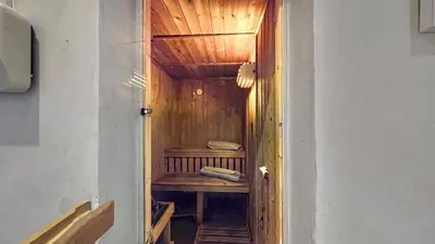 a small room with a wooden bench in a hallway at Finest Retreats - Mill House at Ormidale House in Clachan of Glendaruel