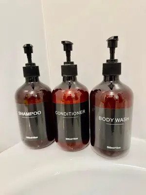 three bottles of alcohol sitting on a shelf at Entire 1 bedroom in VAUXHALL Central London Zone 1 in Moffat