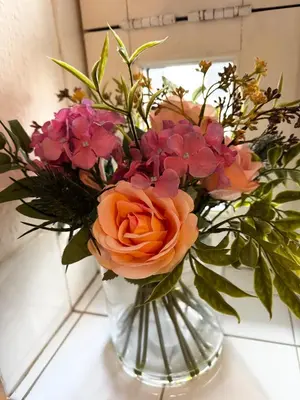 a vase filled with flowers on a table at Entire 1 bedroom in VAUXHALL Central London Zone 1 in Moffat