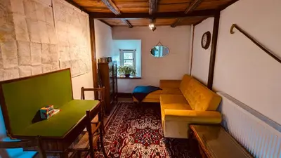 a living room with a couch and a table at Estate Getaway at Powis House Estate in Stirling
