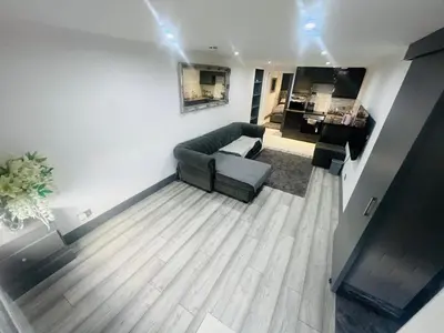 a living room with a couch and a table at 96 Glasgow road in Newbridge