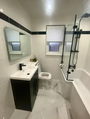 a bathroom with a toilet and a sink and a shower at 4 Bed Detached Home Perfect for Families & Groups in Glasgow
