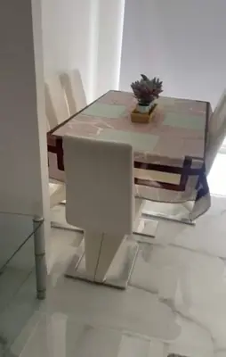 a table with a chair and a computer on it at 4 Bed Detached Home Perfect for Families & Groups in Glasgow