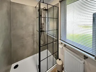 a bathroom with a shower and a toilet at Woodland View in Auchterarder