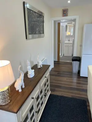 a kitchen with a counter with figurines on it at Canal View Cottage in Winchburgh