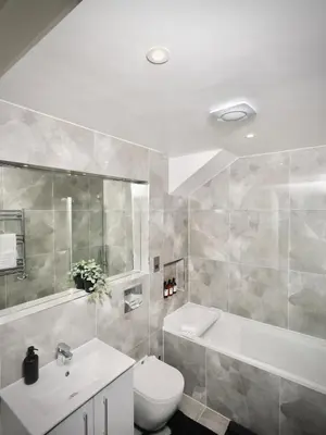 a bathroom with a sink and a toilet and a tub at Premium 4BR I Near Golf Course I Fast Wi-Fi & Free Parking in Moffat