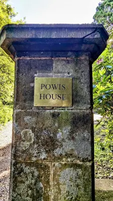 a sign that says powers house on a stone wall at Luxury Shepherds Hut on Powis House Estate in Stirling